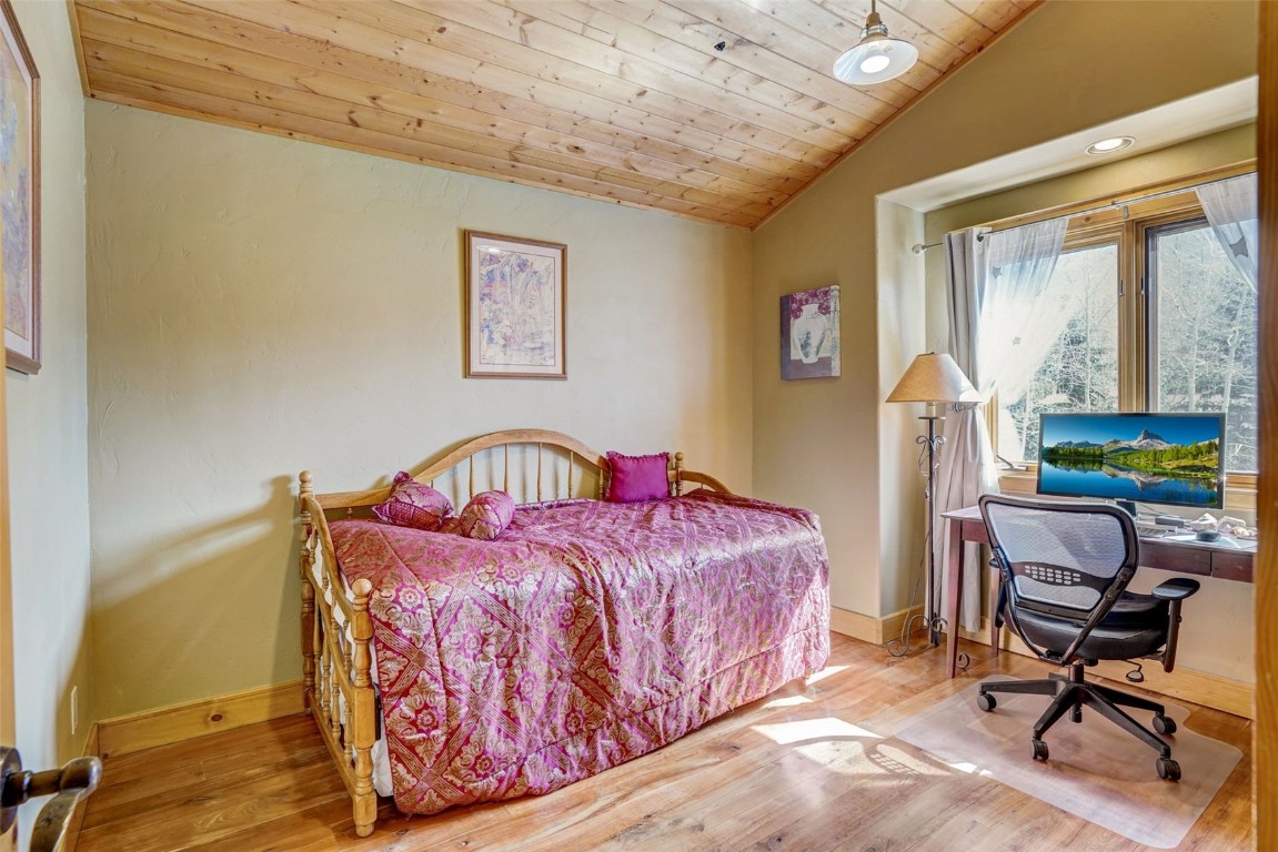 145 Gold Run Circle Dillon, CO 80435 - Photo 18 of 50 a bedroom with a bed and a table