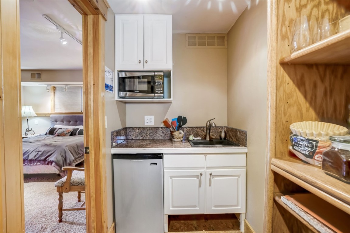 145 Gold Run Circle Dillon, CO 80435 - Photo 41 of 50 a kitchen with stainless steel appliances granite countertop a sink and cabinets