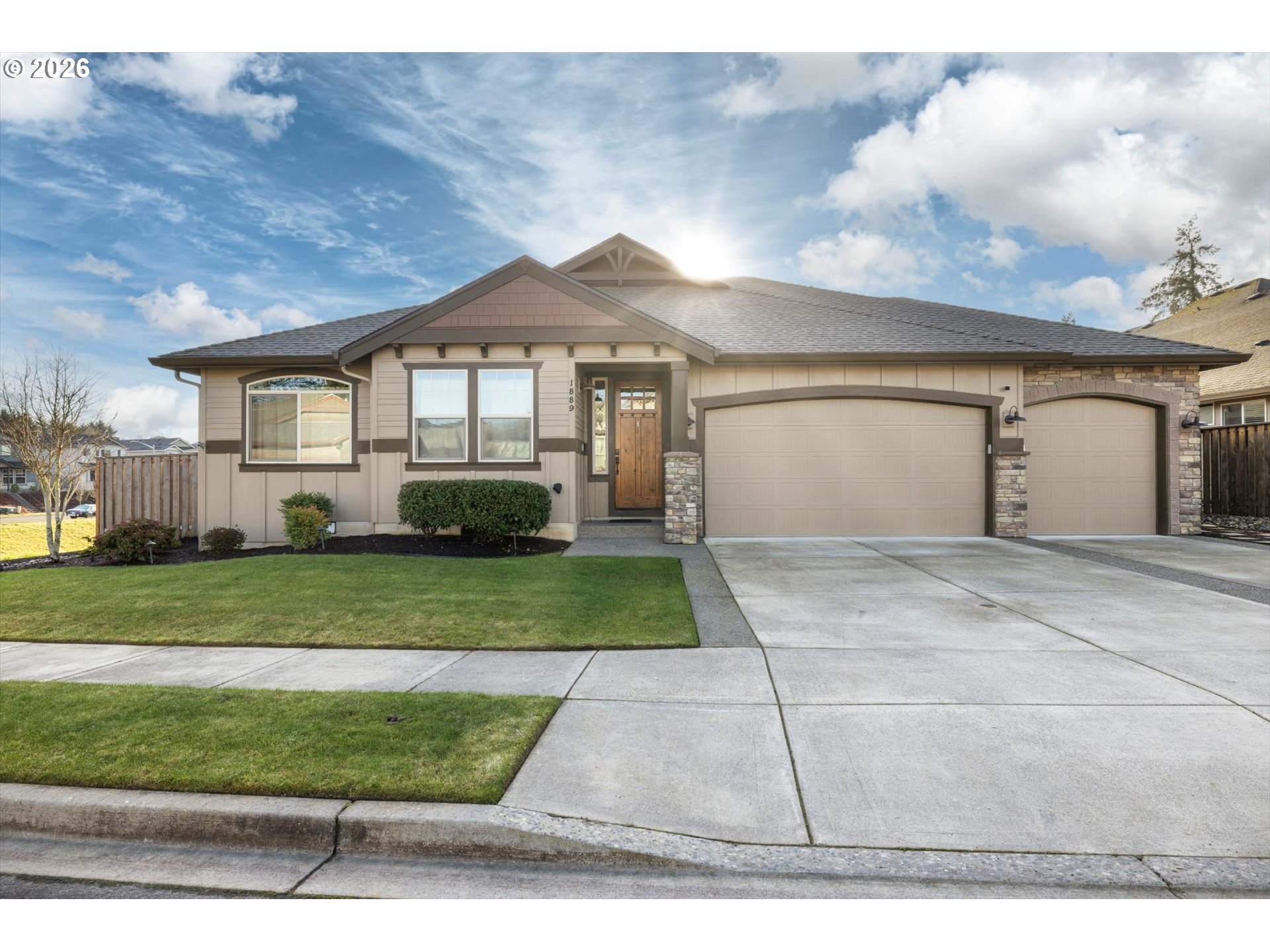 1889 South Harrier Road Ridgefield, WA 98642 - Photo 1 of 29 a front view of a house with a yard and garage
