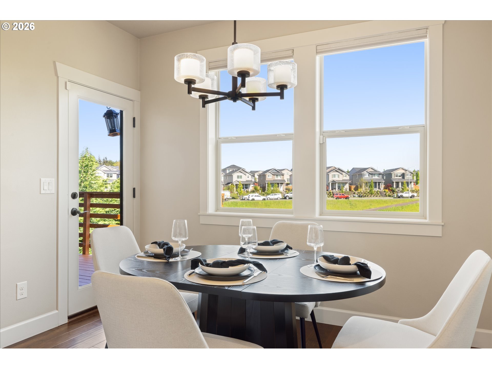 1889 South Harrier Road Ridgefield, WA 98642 - Photo 12 of 29 a view of a dining room with furniture a chandelier and wooden floor