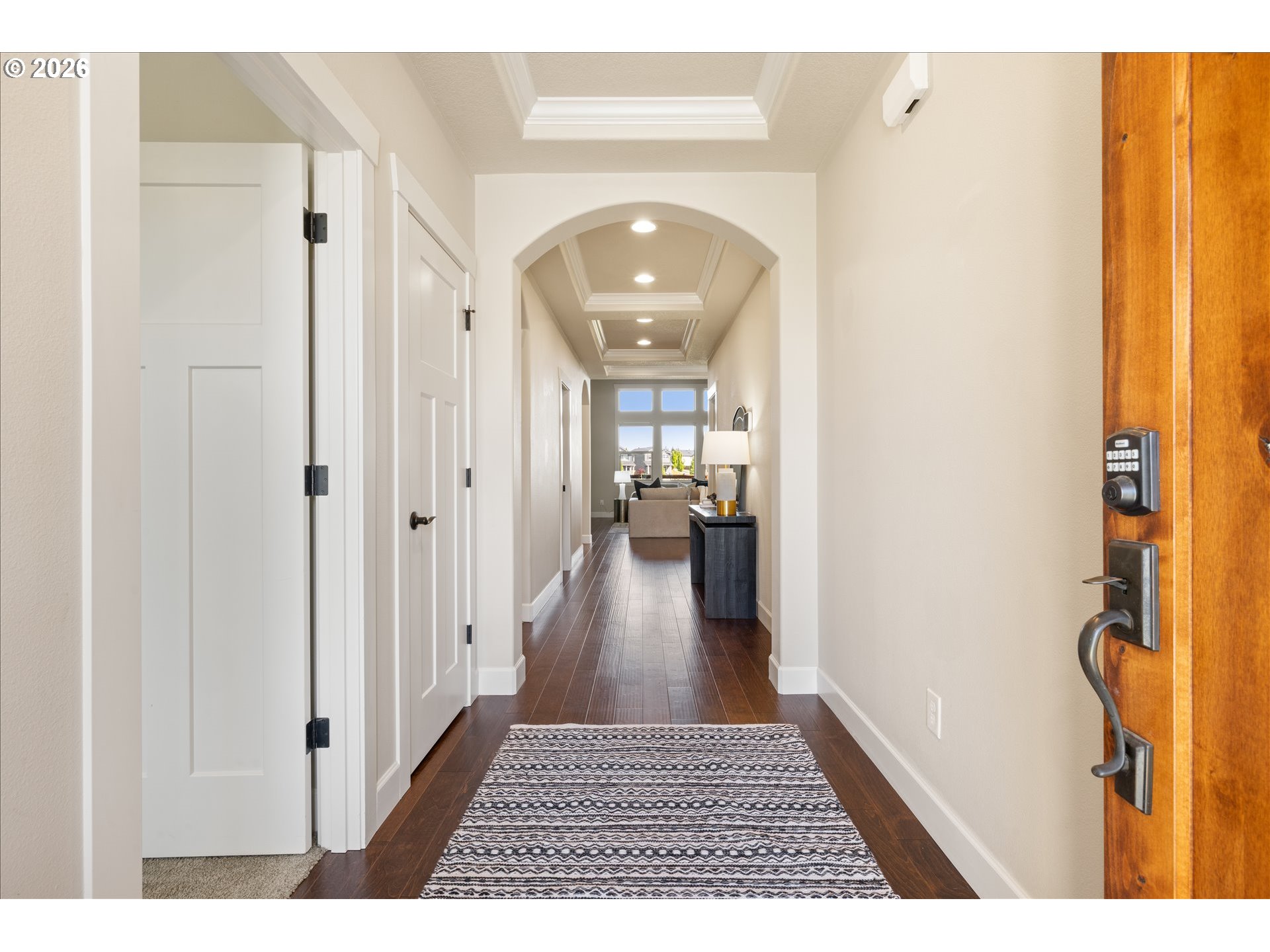1889 South Harrier Road Ridgefield, WA 98642 - Photo 2 of 29 a view of a hallway with wooden floor and a living room