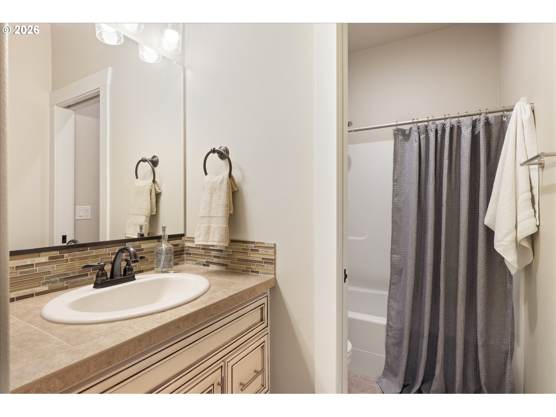 1889 South Harrier Road Ridgefield, WA 98642 - Photo 23 of 29 a bathroom with a sink vanity and a mirror