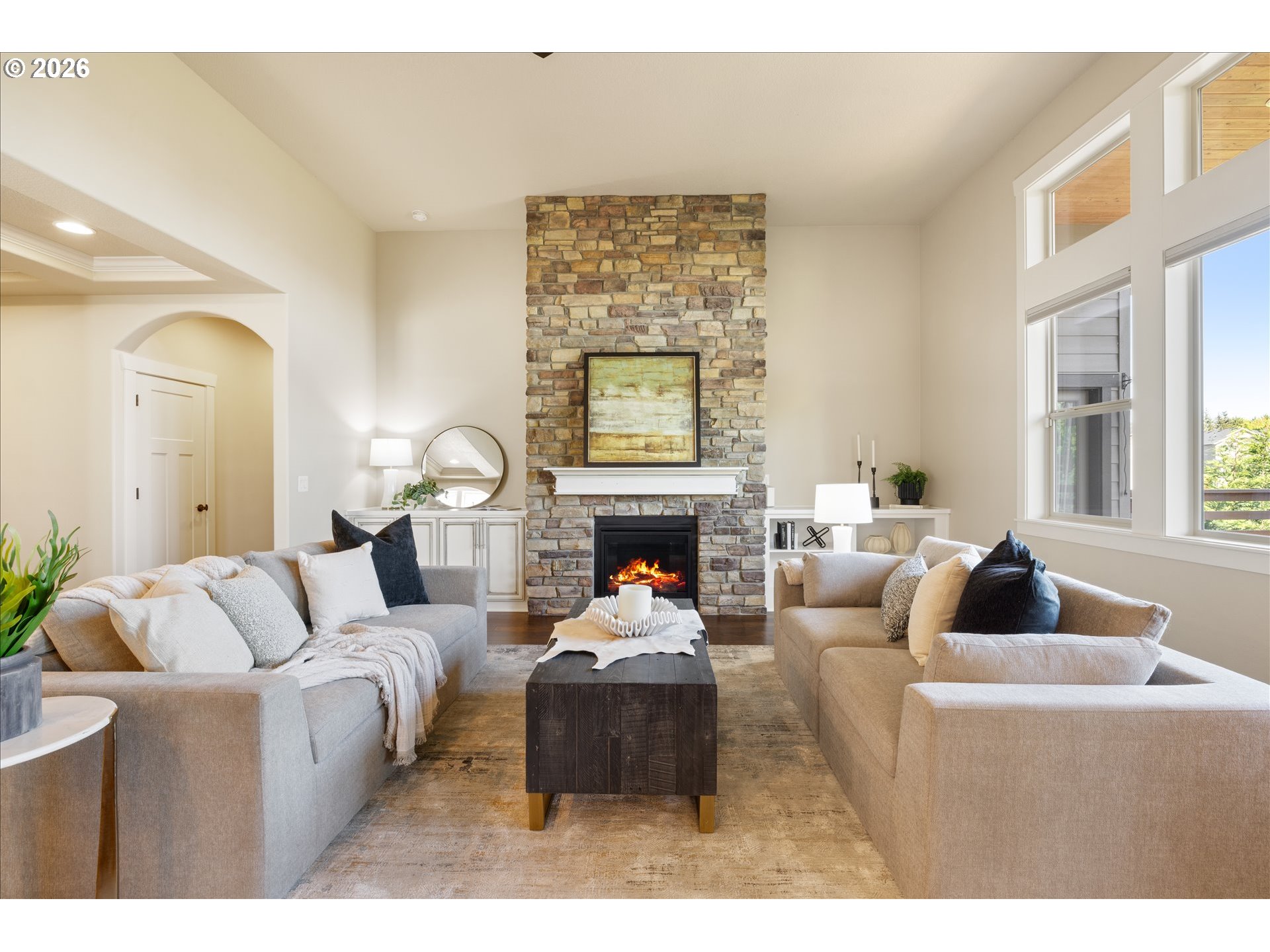 1889 South Harrier Road Ridgefield, WA 98642 - Photo 5 of 29 a living room with furniture a fireplace and a large mirror