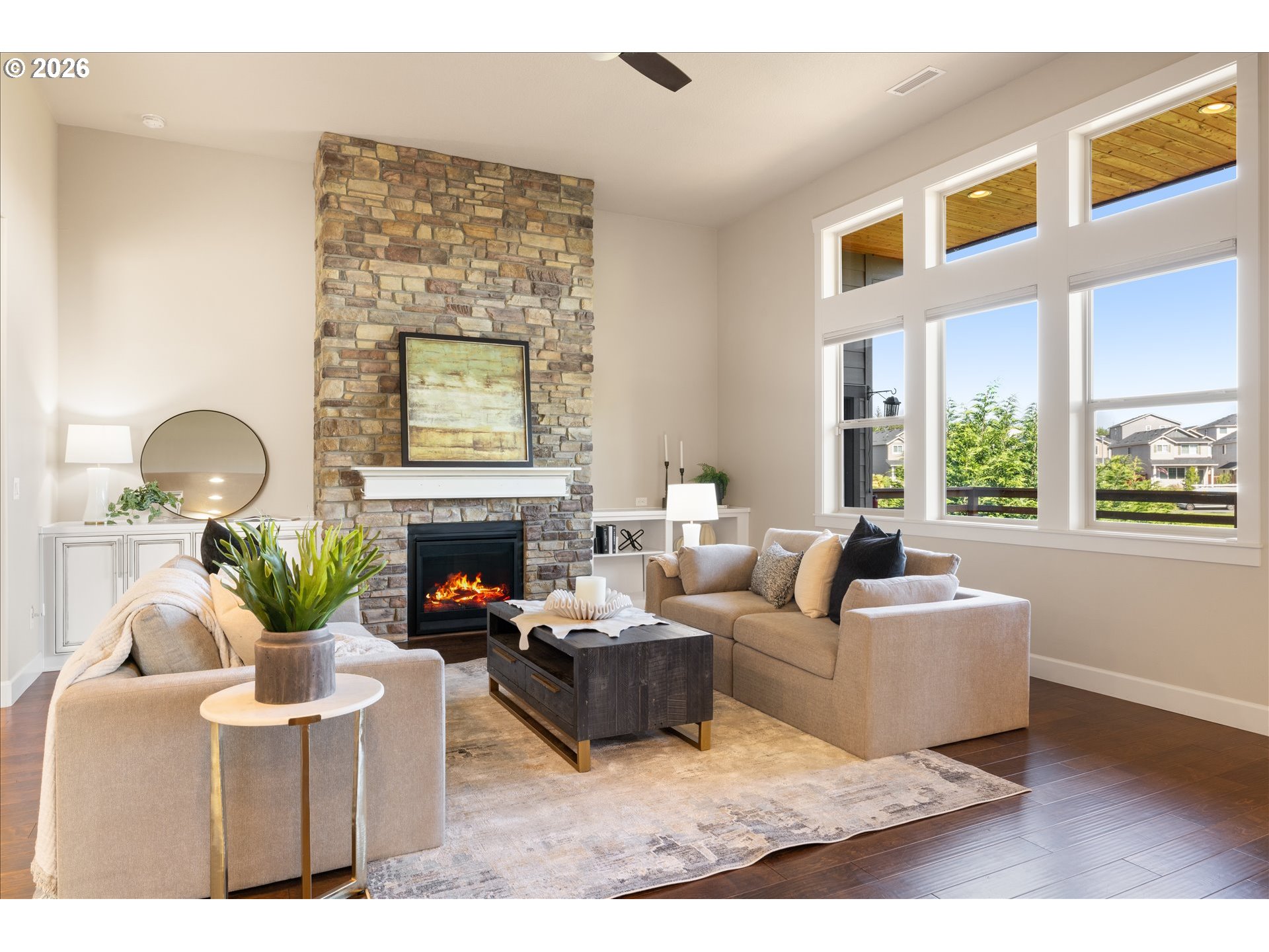 1889 South Harrier Road Ridgefield, WA 98642 - Photo 6 of 29 a living room with furniture a fireplace and a potted plant