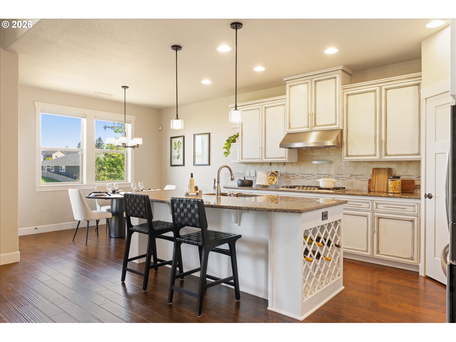 1889 South Harrier Road Ridgefield, WA 98642 - Photo 8 of 29 a kitchen with counter space sink refrigerator dining table and chairs