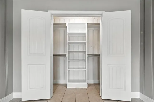 a view of an empty walk in closet