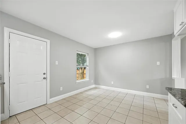 a view of an empty room and window