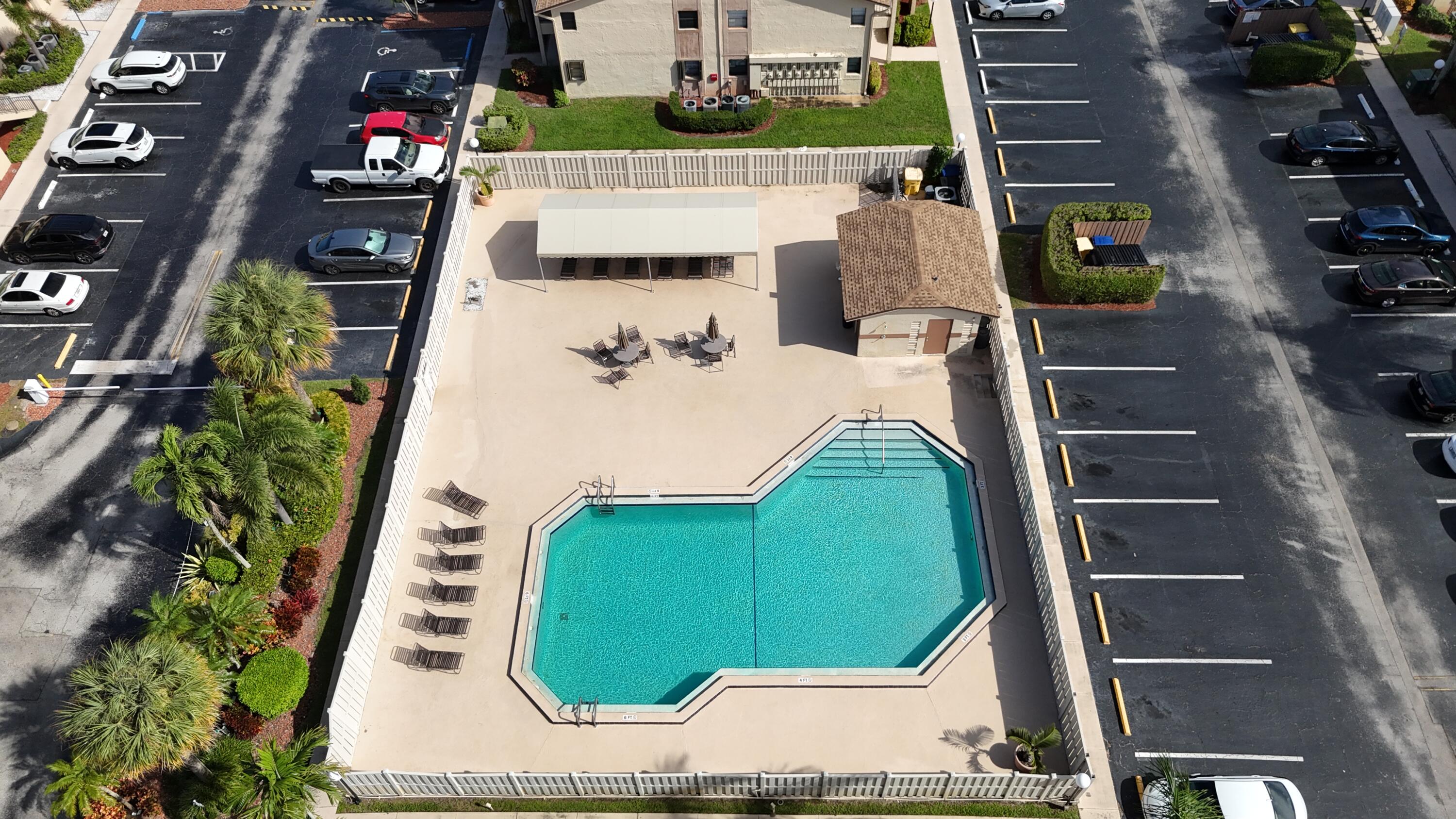 9503 Boca Cove Circle, Unit 602 Boca Raton, FL 33428 - Photo 3 of 24 an aerial view of a kitchen with outdoor seating