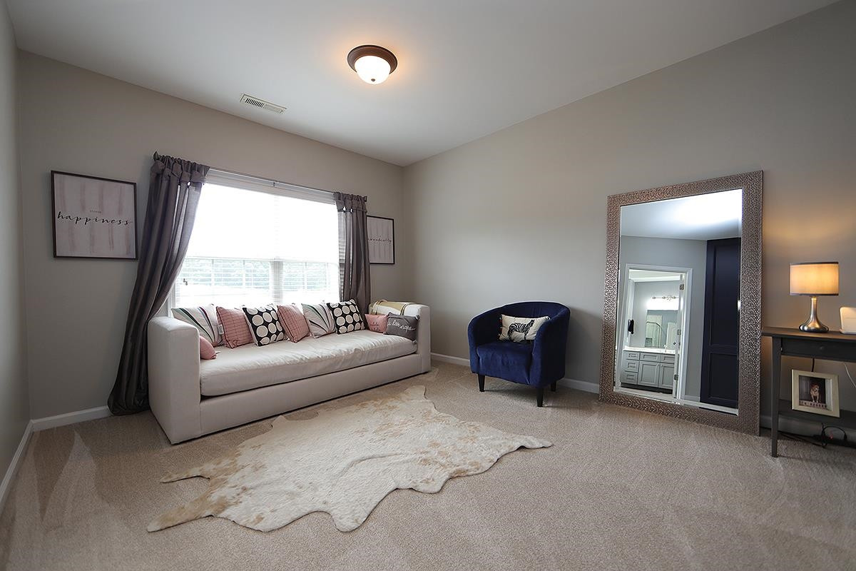 1105 Weston Green Loop Cary, NC 27513 - Photo 12 of 24 a living room with furniture and a window