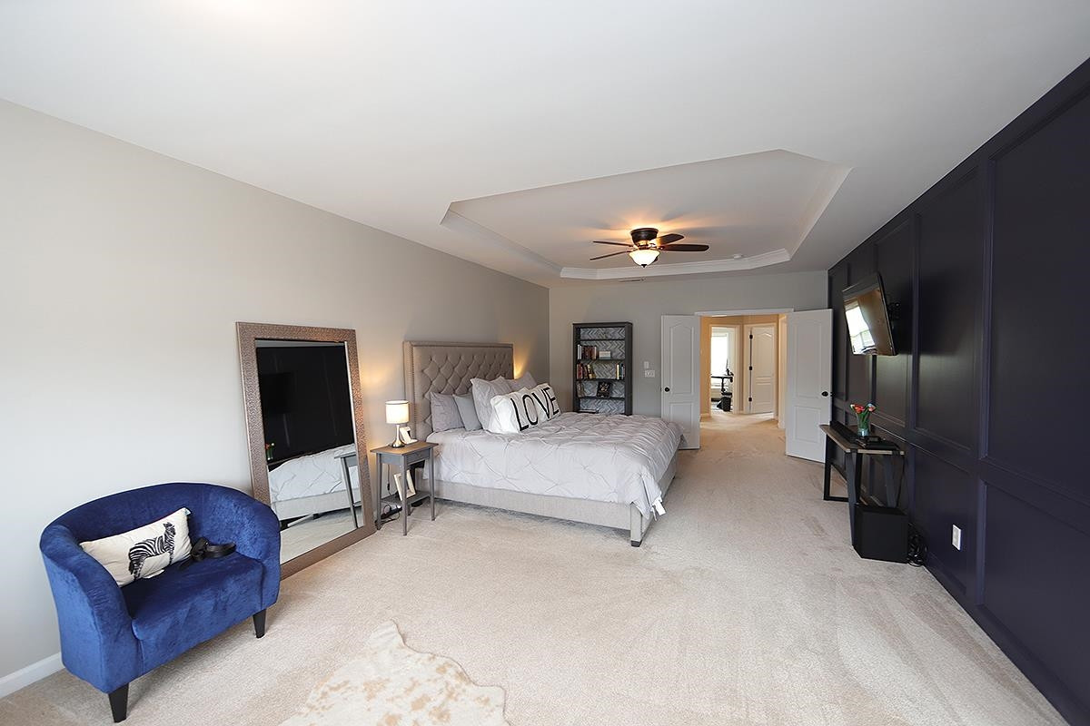 1105 Weston Green Loop Cary, NC 27513 - Photo 13 of 24 a living room with furniture and a lamp