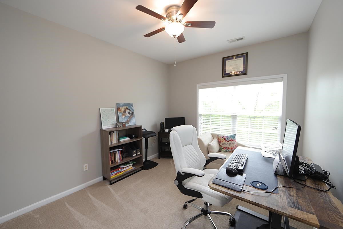 1105 Weston Green Loop Cary, NC 27513 - Photo 20 of 24 a view of a workspace with furniture and a window