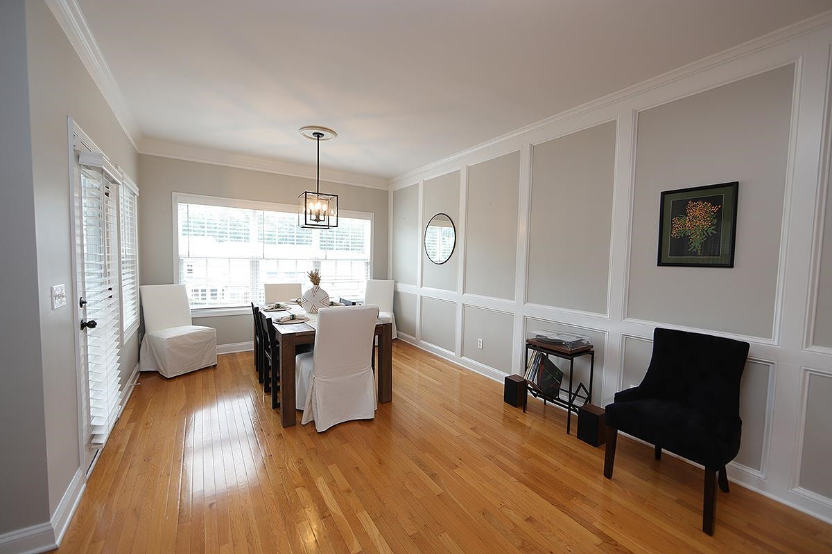 1105 Weston Green Loop Cary, NC 27513 - Photo 7 of 24 a living room with furniture and a wooden floor