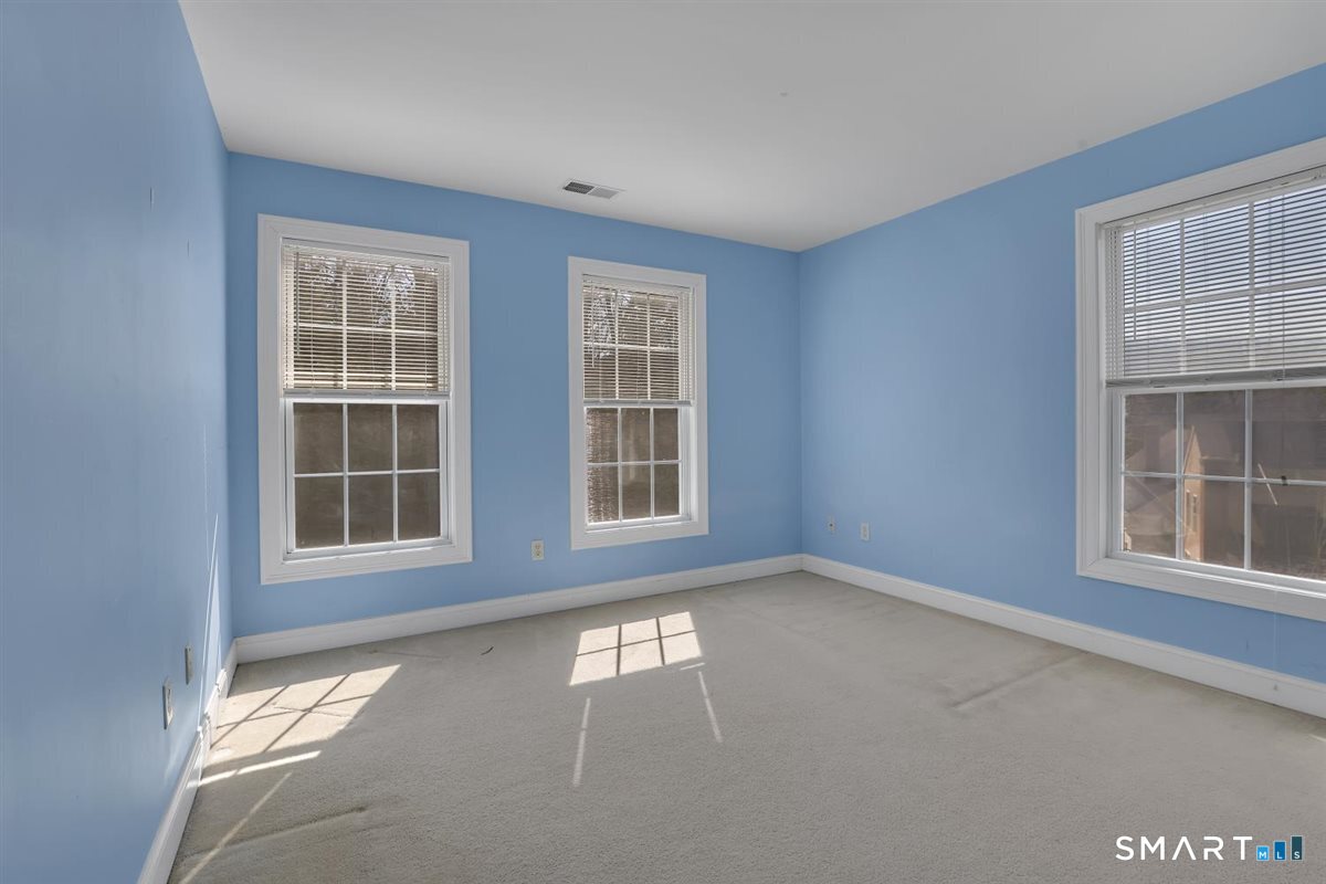 25 Fenwick Drive Avon, CT 06001 - Photo 29 of 40 a view of an empty room with a window