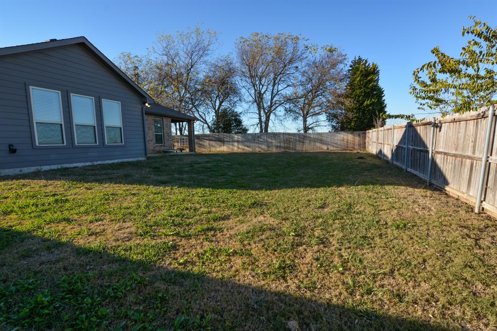 601 Mathew Street Grandview, TX 76050 - Photo 37 of 40 a view of backyard with green space