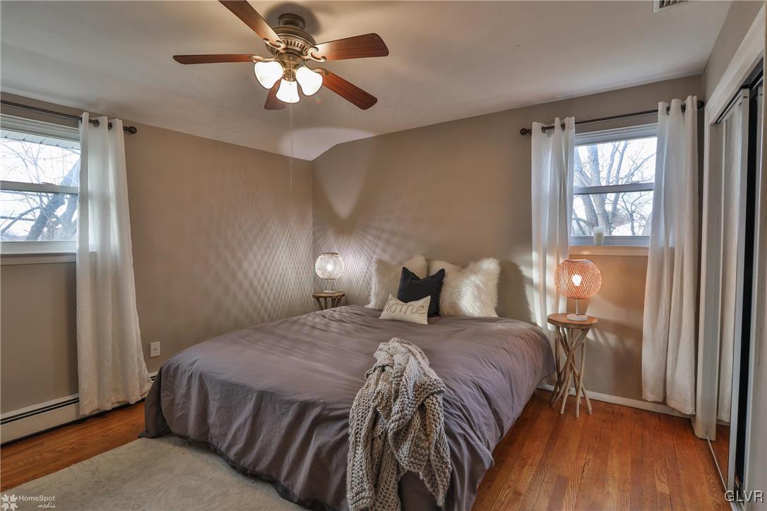 1518 Ralston Road Bethlehem, PA 18018 - Photo 20 of 50 a bedroom with a bed and wooden floor