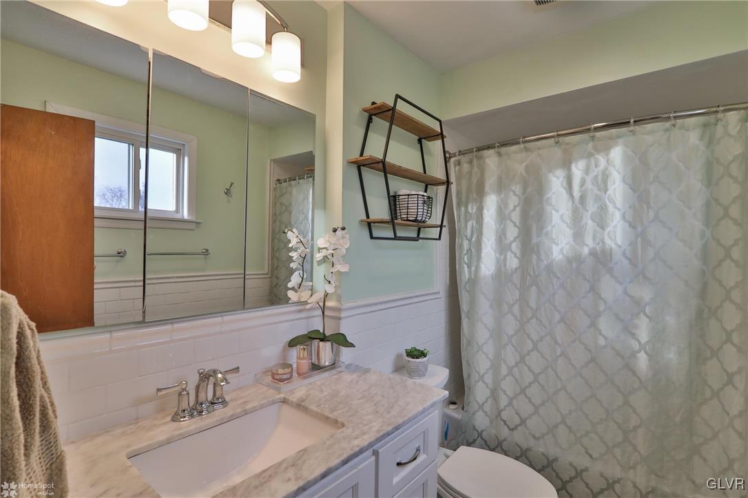 1518 Ralston Road Bethlehem, PA 18018 - Photo 23 of 50 a bathroom with a granite countertop sink toilet and shower