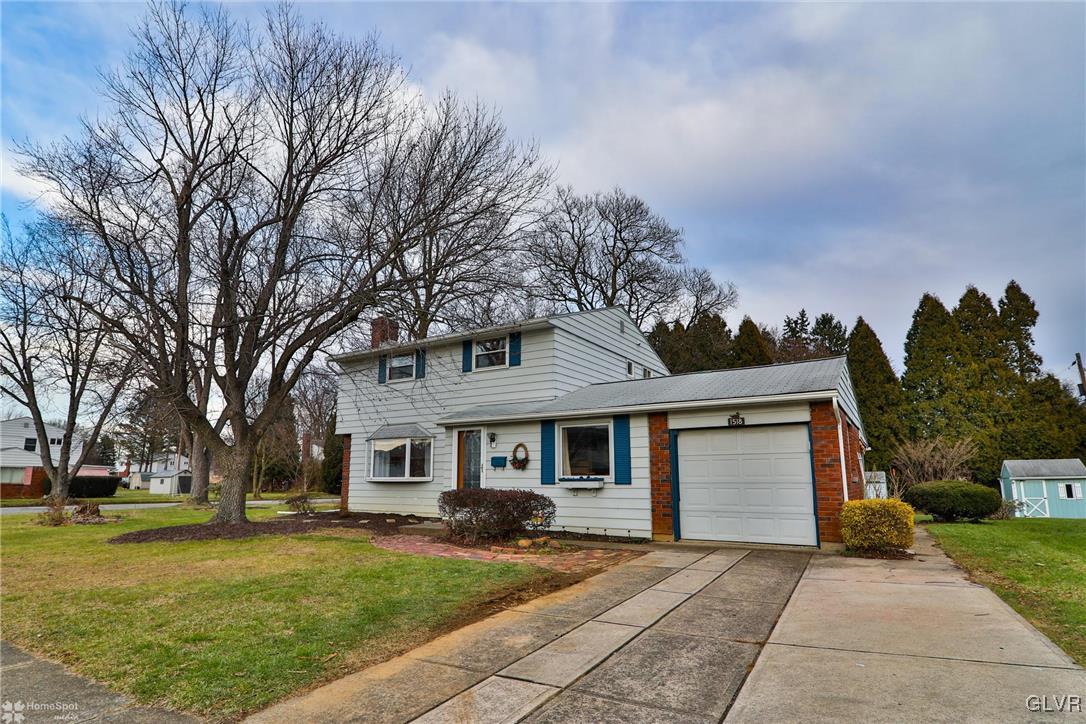1518 Ralston Road Bethlehem, PA 18018 - Photo 50 of 50 a front view of a house with a garden and trees