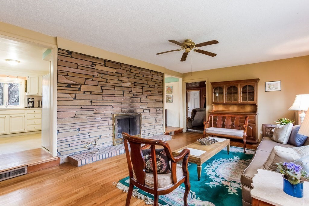 181 Newton Road Springfield, MA 01118 - Photo 4 of 24 a living room with furniture wooden floor and a fireplace