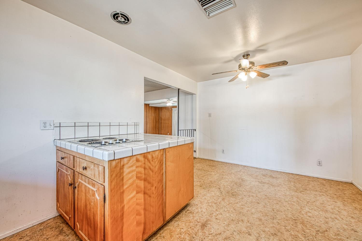 148 Russell Avenue Clovis, CA 93612 - Photo 12 of 33 an empty room with a stove and a sink
