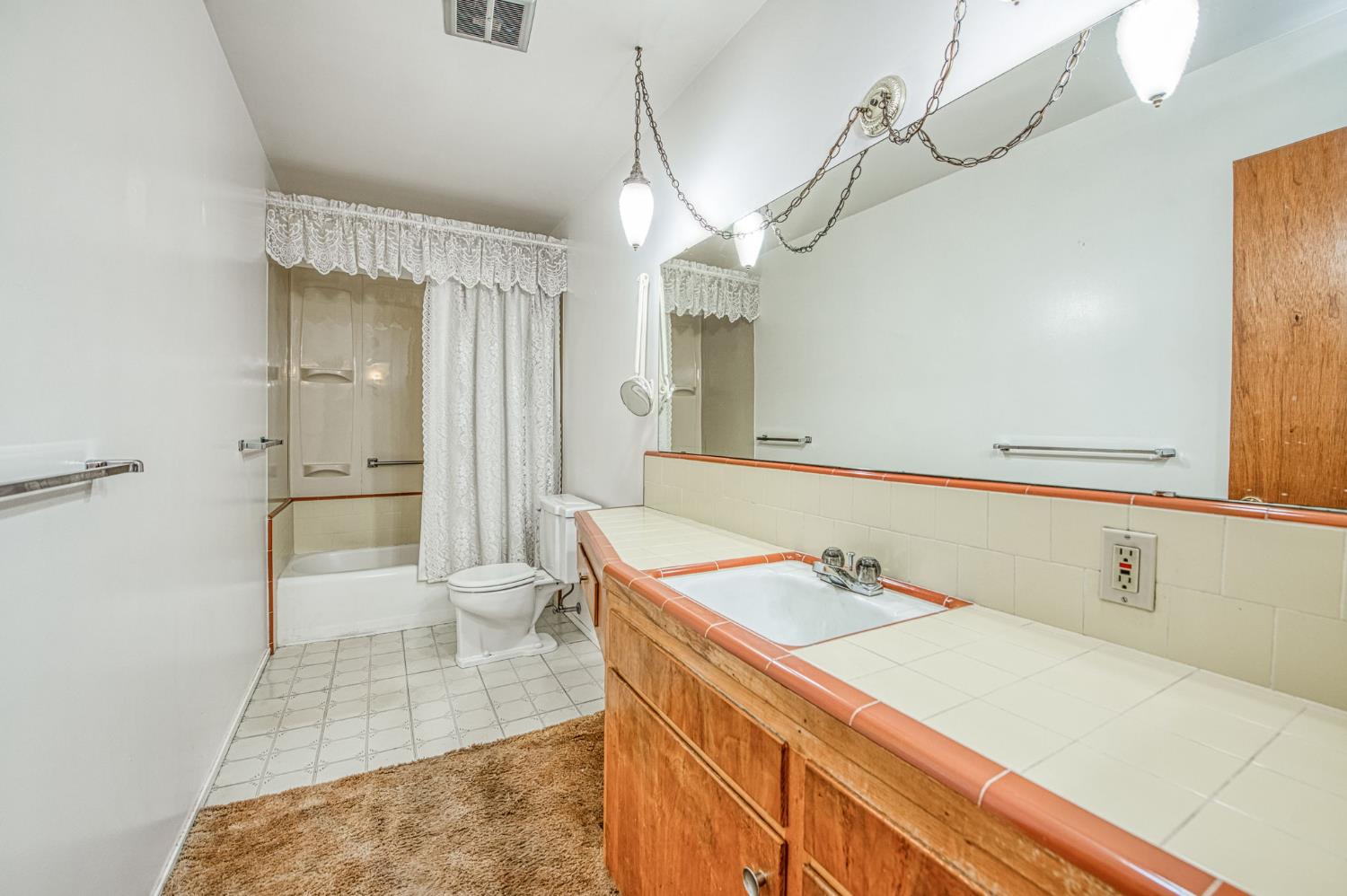 148 Russell Avenue Clovis, CA 93612 - Photo 18 of 33 a bathroom with a sink a toilet and shower