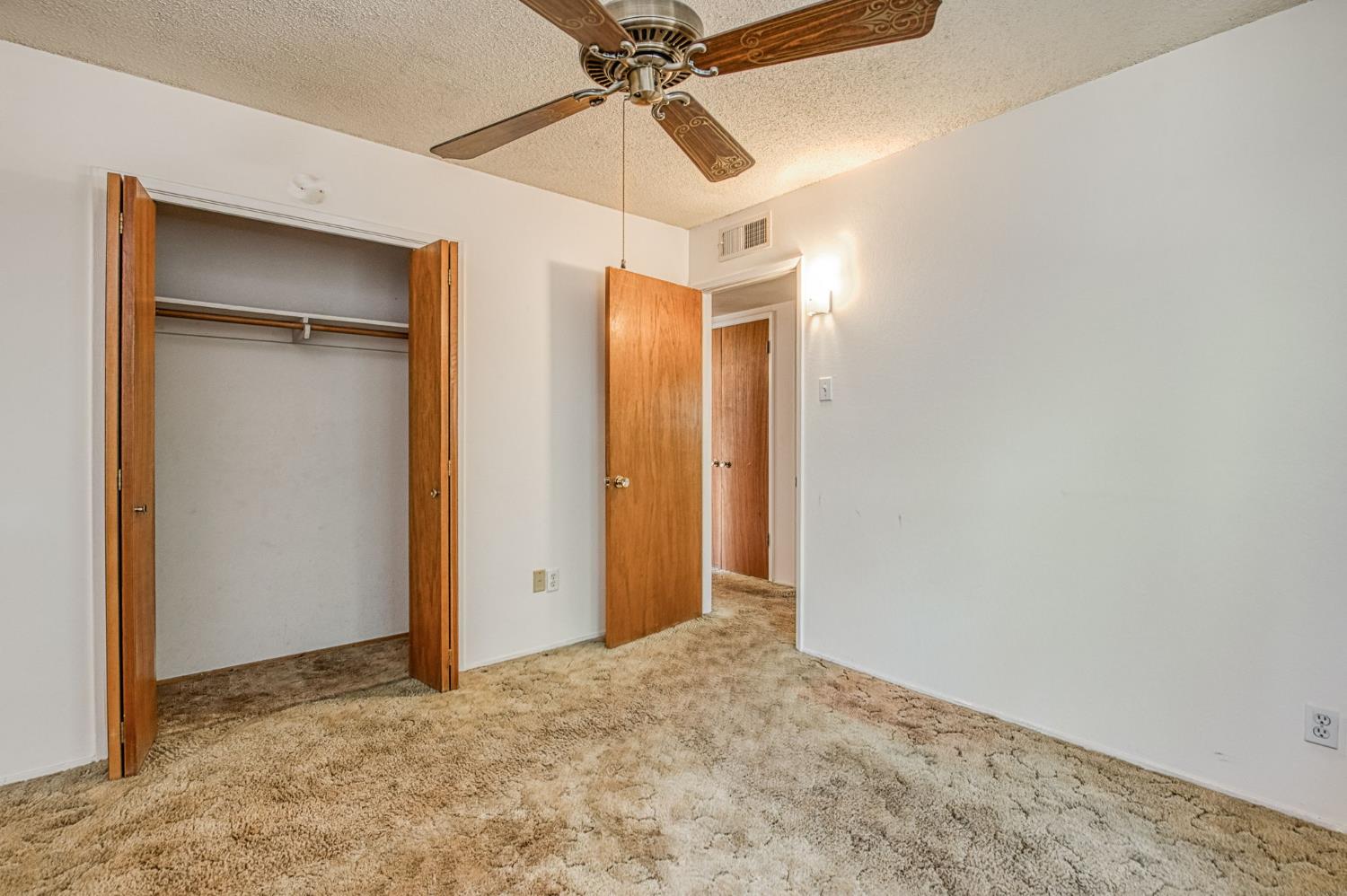 148 Russell Avenue Clovis, CA 93612 - Photo 22 of 33 a view of a big room with closet and chandelier fan