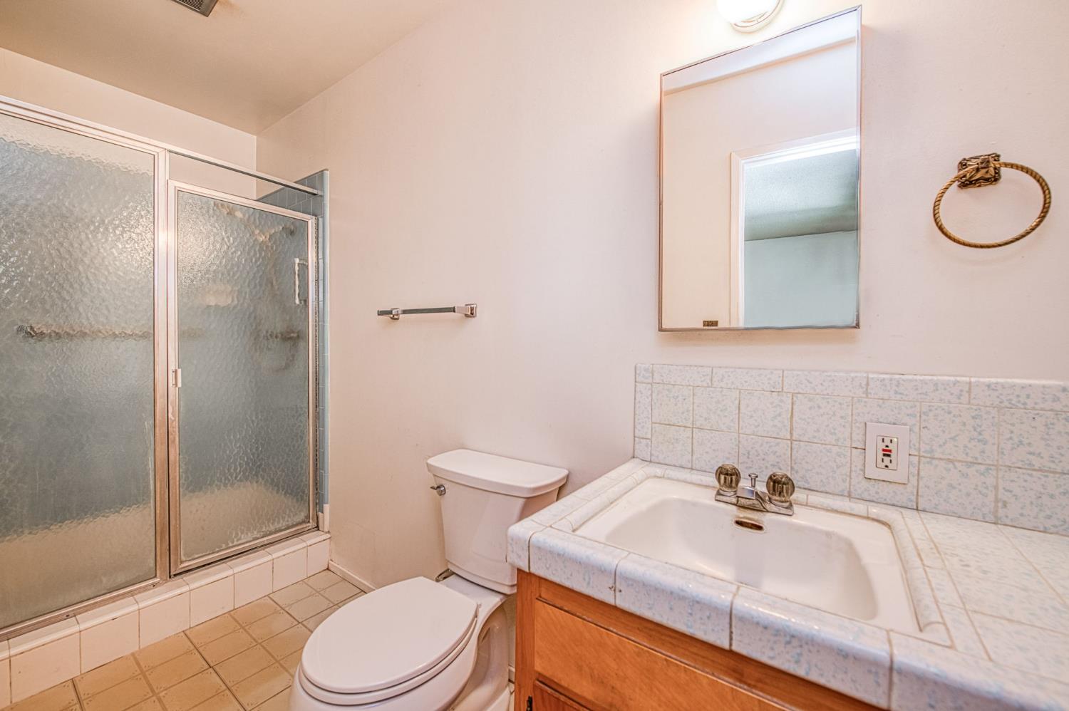 148 Russell Avenue Clovis, CA 93612 - Photo 25 of 33 a bathroom with a sink toilet and shower