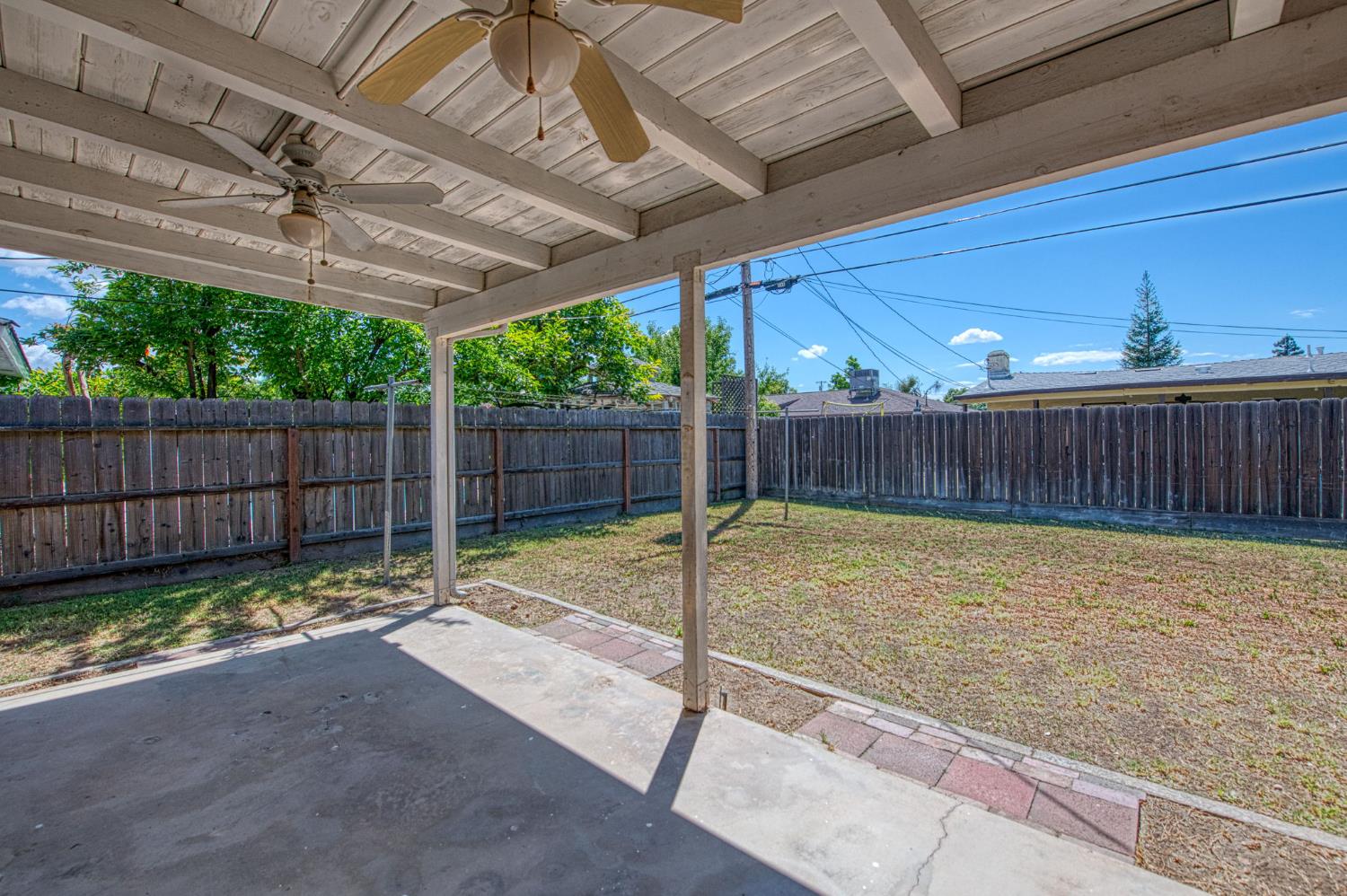 148 Russell Avenue Clovis, CA 93612 - Photo 26 of 33 a view of a backyard with wooden fence