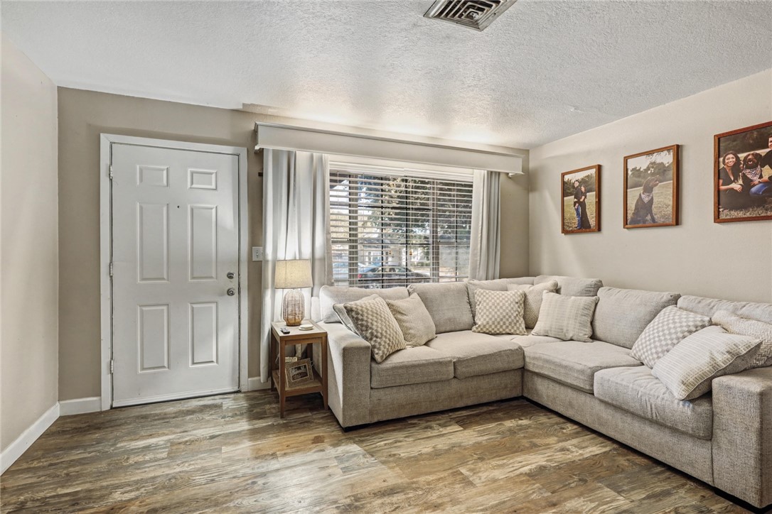 708 East Main Street Sinton, TX 78387 - Photo 3 of 28 a living room with furniture and a window