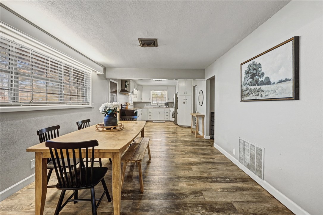 708 East Main Street Sinton, TX 78387 - Photo 8 of 28 a view of a dining room with furniture window and wooden floor