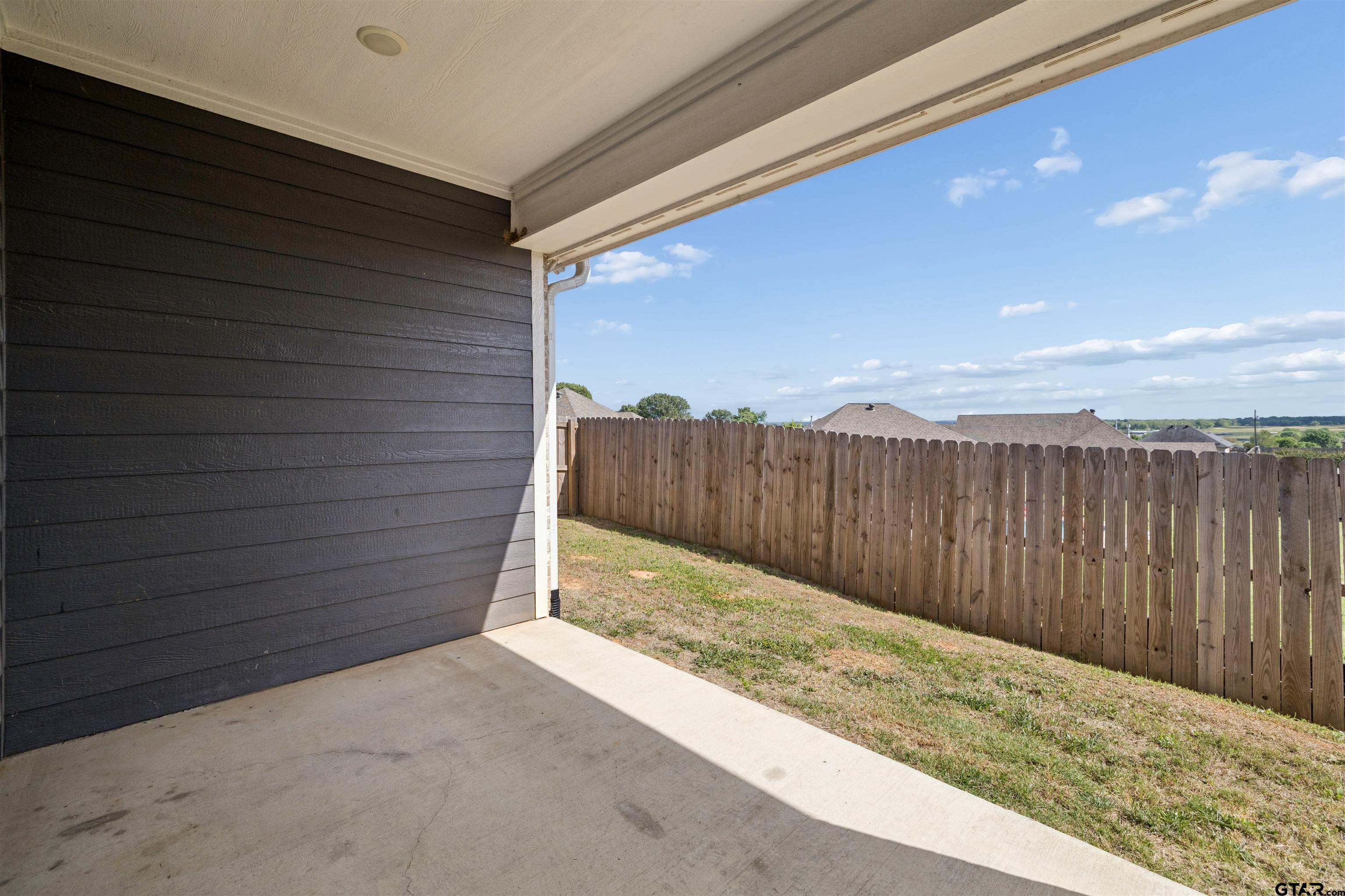 629 Third Street Bullard, TX 75757 - Photo 17 of 18 a view of a pathway gate with wooden fence