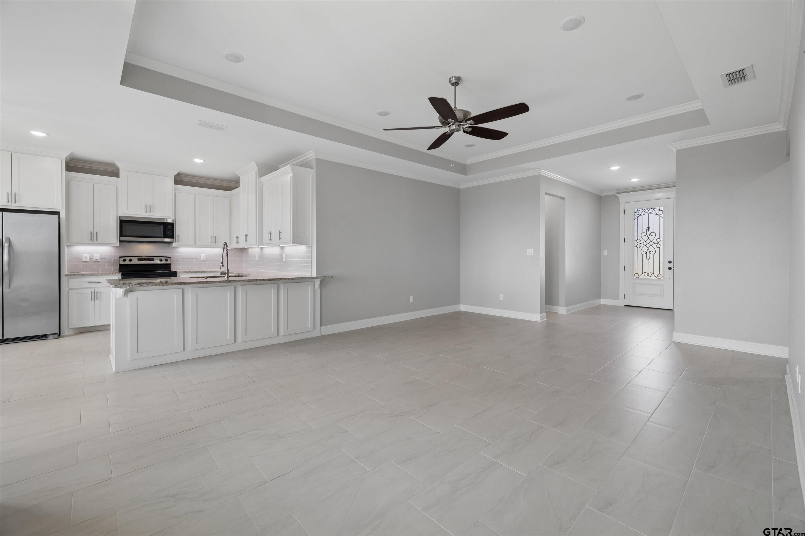 629 Third Street Bullard, TX 75757 - Photo 3 of 18 a view of a kitchen with a sink stainless steel appliances and cabinets
