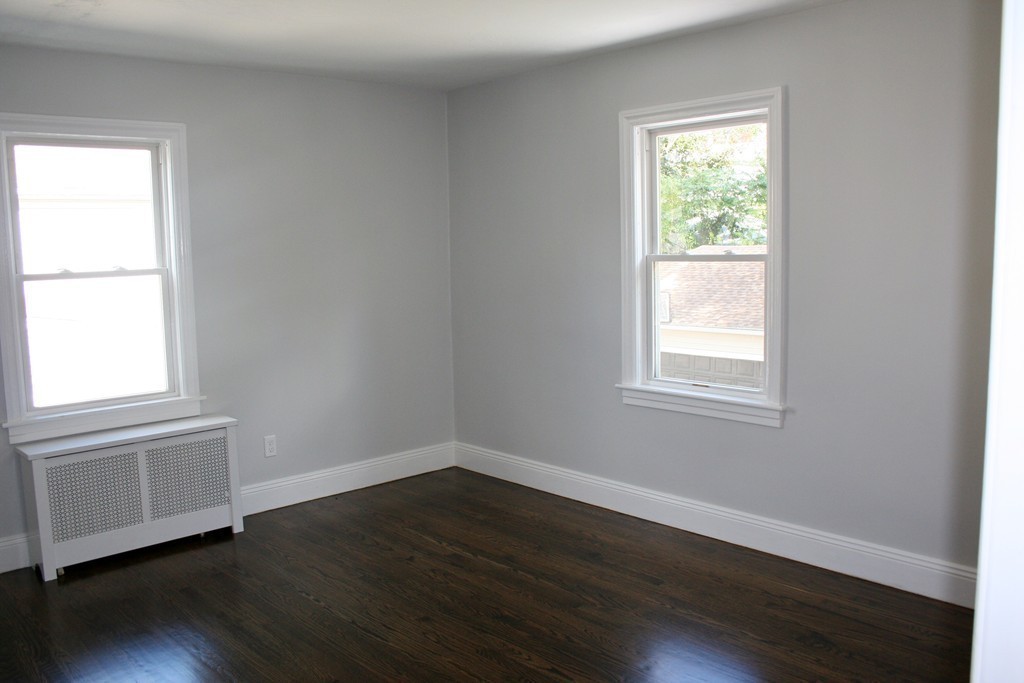 19 Dellwood Road Worcester, MA 01602 - Photo 14 of 26 an empty room with wooden floor and a window