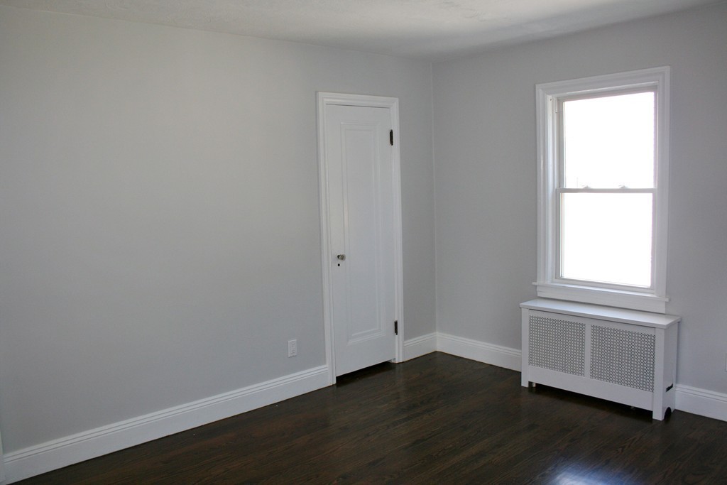19 Dellwood Road Worcester, MA 01602 - Photo 15 of 26 an empty room with wooden floor and windows