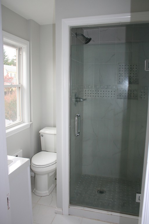 19 Dellwood Road Worcester, MA 01602 - Photo 17 of 26 a bathroom with a toilet and a shower