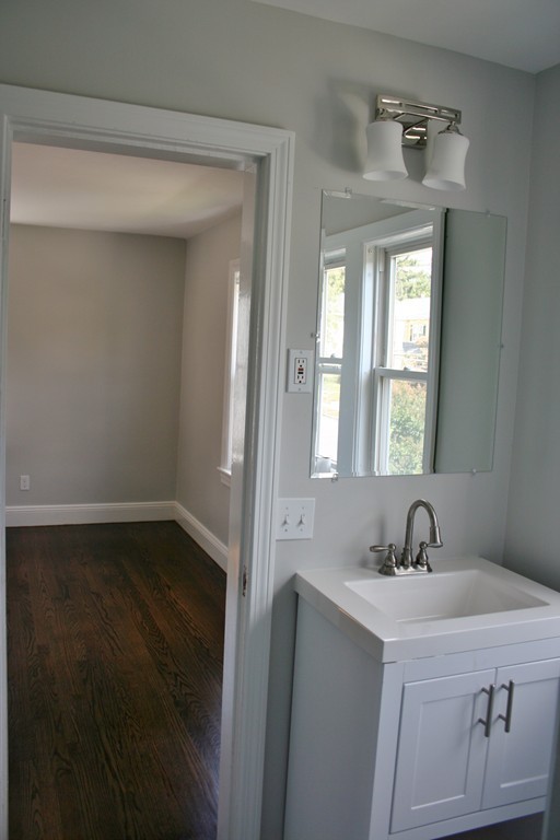 19 Dellwood Road Worcester, MA 01602 - Photo 19 of 26 a bathroom with a sink and a window