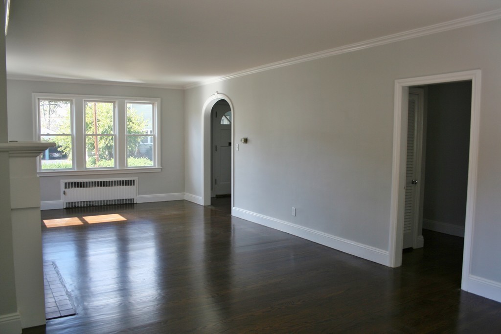 19 Dellwood Road Worcester, MA 01602 - Photo 6 of 26 an empty room with wooden floor and windows