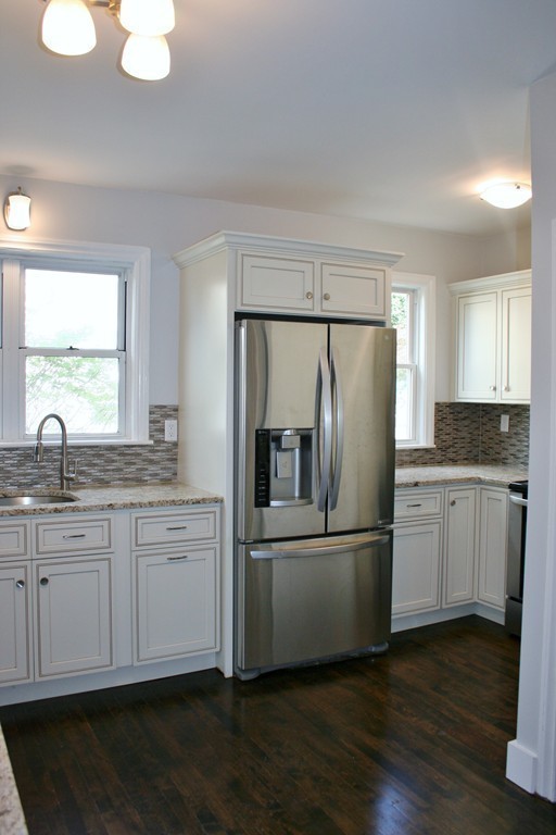 19 Dellwood Road Worcester, MA 01602 - Photo 10 of 26 a kitchen with stainless steel appliances granite countertop a refrigerator a sink and a stove