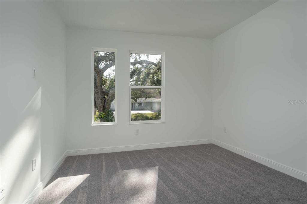 318 Rafael Boulevard Northeast St. Petersburg, FL 33704 - Photo 15 of 38 an empty room with windows