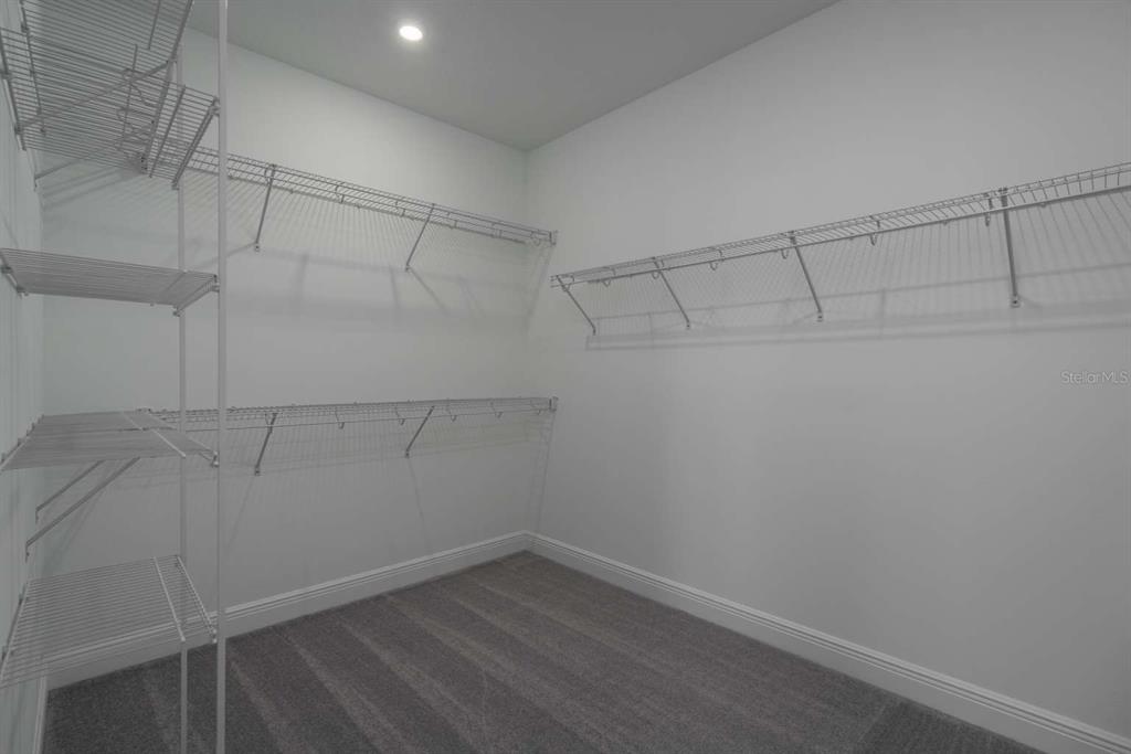 318 Rafael Boulevard Northeast St. Petersburg, FL 33704 - Photo 25 of 38 a view of a room with racks on the wall