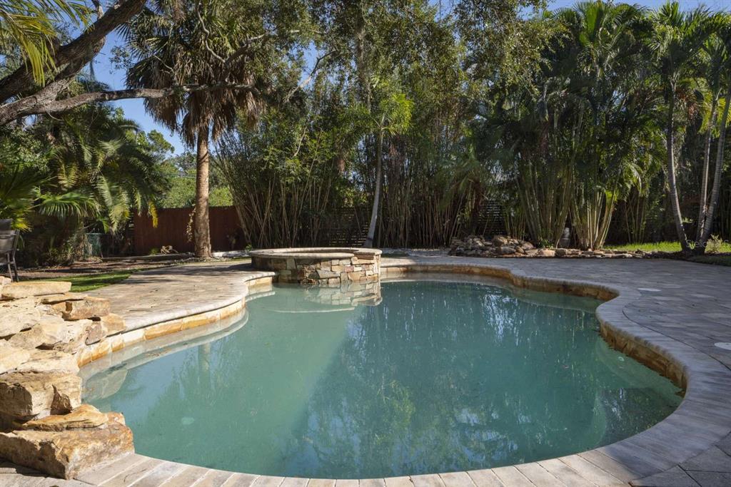 318 Rafael Boulevard Northeast St. Petersburg, FL 33704 - Photo 36 of 38 a view of a swimming pool with a sitting area
