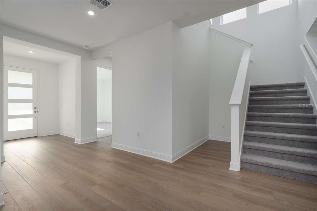 318 Rafael Boulevard Northeast St. Petersburg, FL 33704 - Photo 4 of 38 a view of entryway with wooden floor