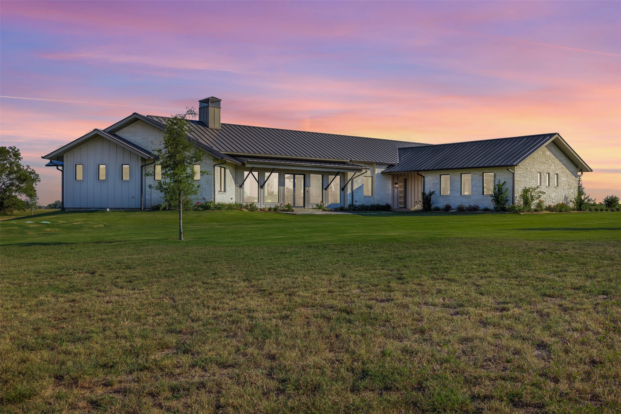 4961 Hartfield Road Round Top, TX 78954 - Photo 21 of 22 a front view of a house with yard and green space