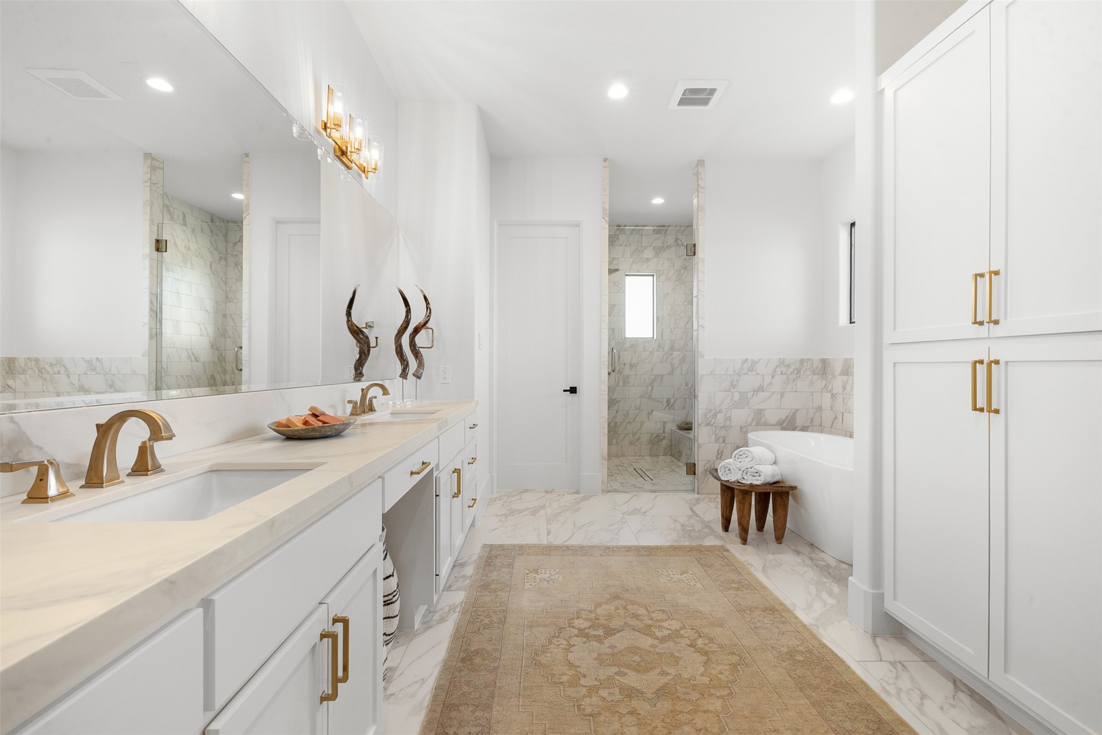 4961 Hartfield Road Round Top, TX 78954 - Photo 10 of 22 a spacious bathroom with a double vanity sink mirror and shower