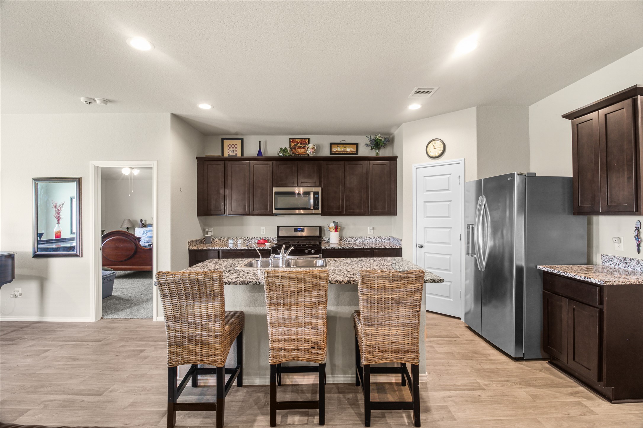 6706 Twin Oaks Lane Rosenberg, TX 77469 - Photo 8 of 32 Living area open to the kitchen with island