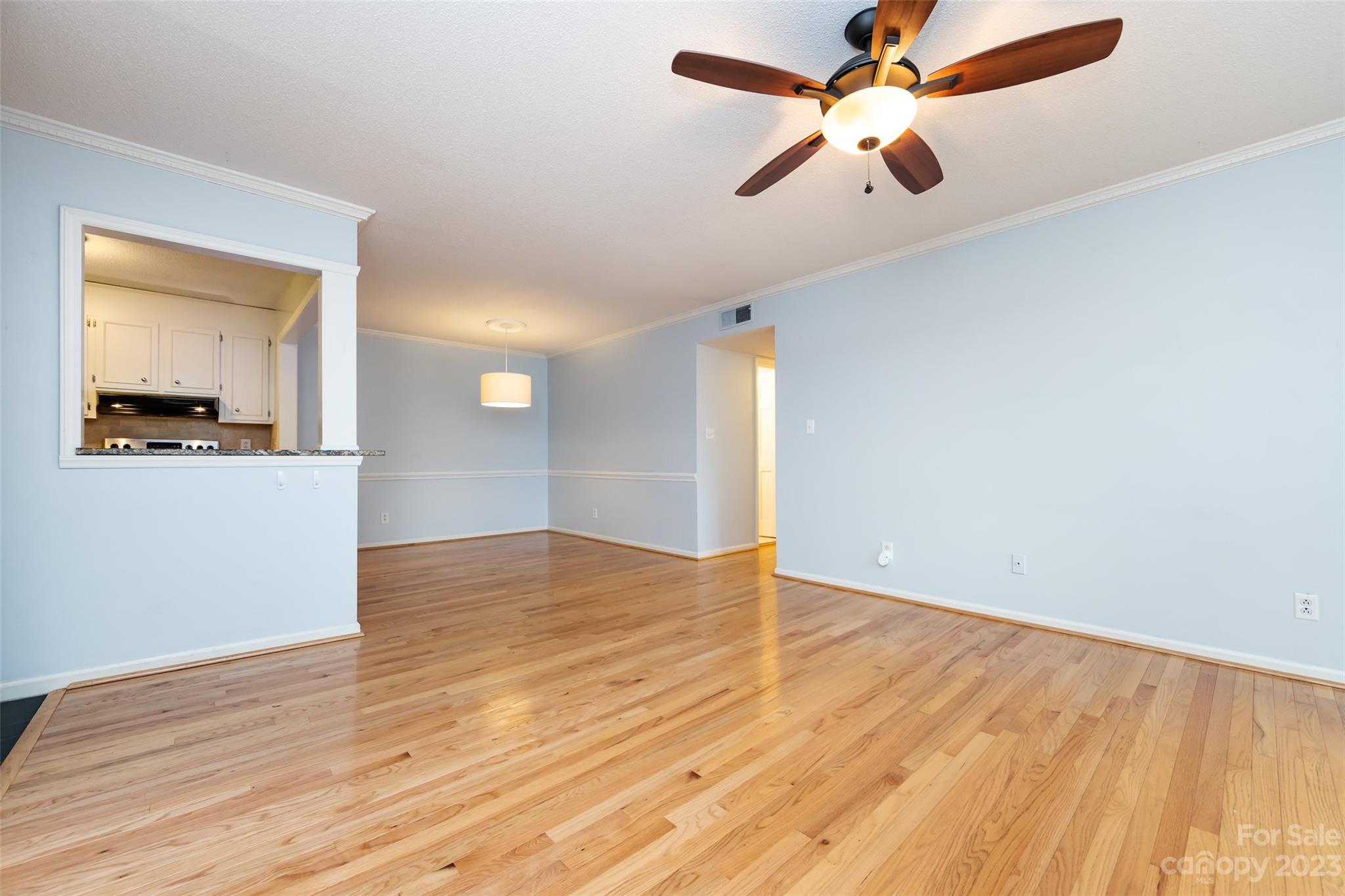 1336 Queens Road Charlotte, NC 28207 - Photo 12 of 36 a view of empty room with wooden floor and fan