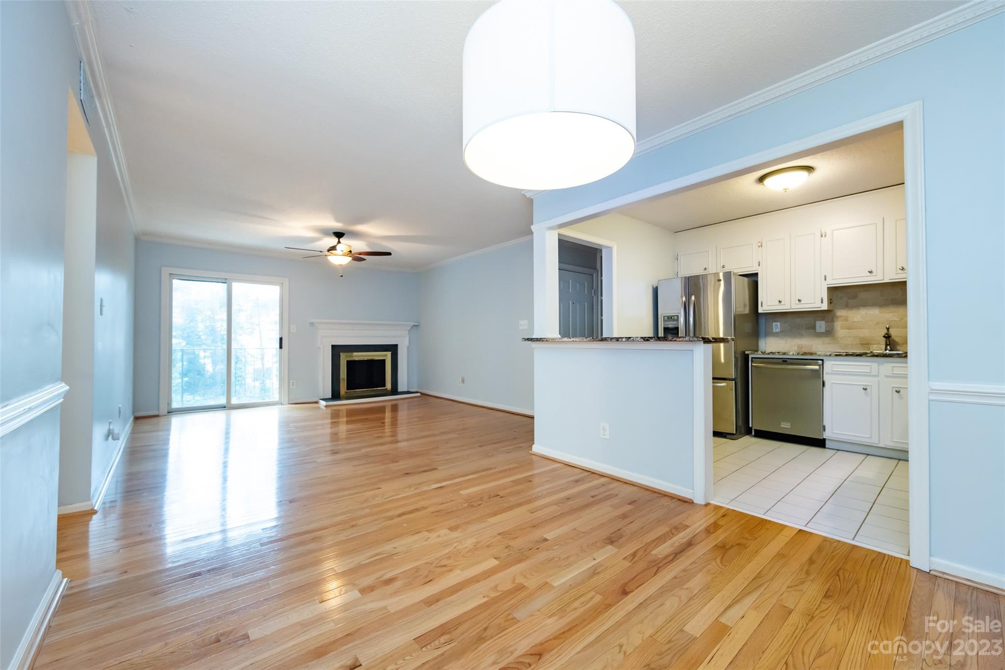 1336 Queens Road Charlotte, NC 28207 - Photo 16 of 36 a view of a kitchen with wooden floor and a kitchen