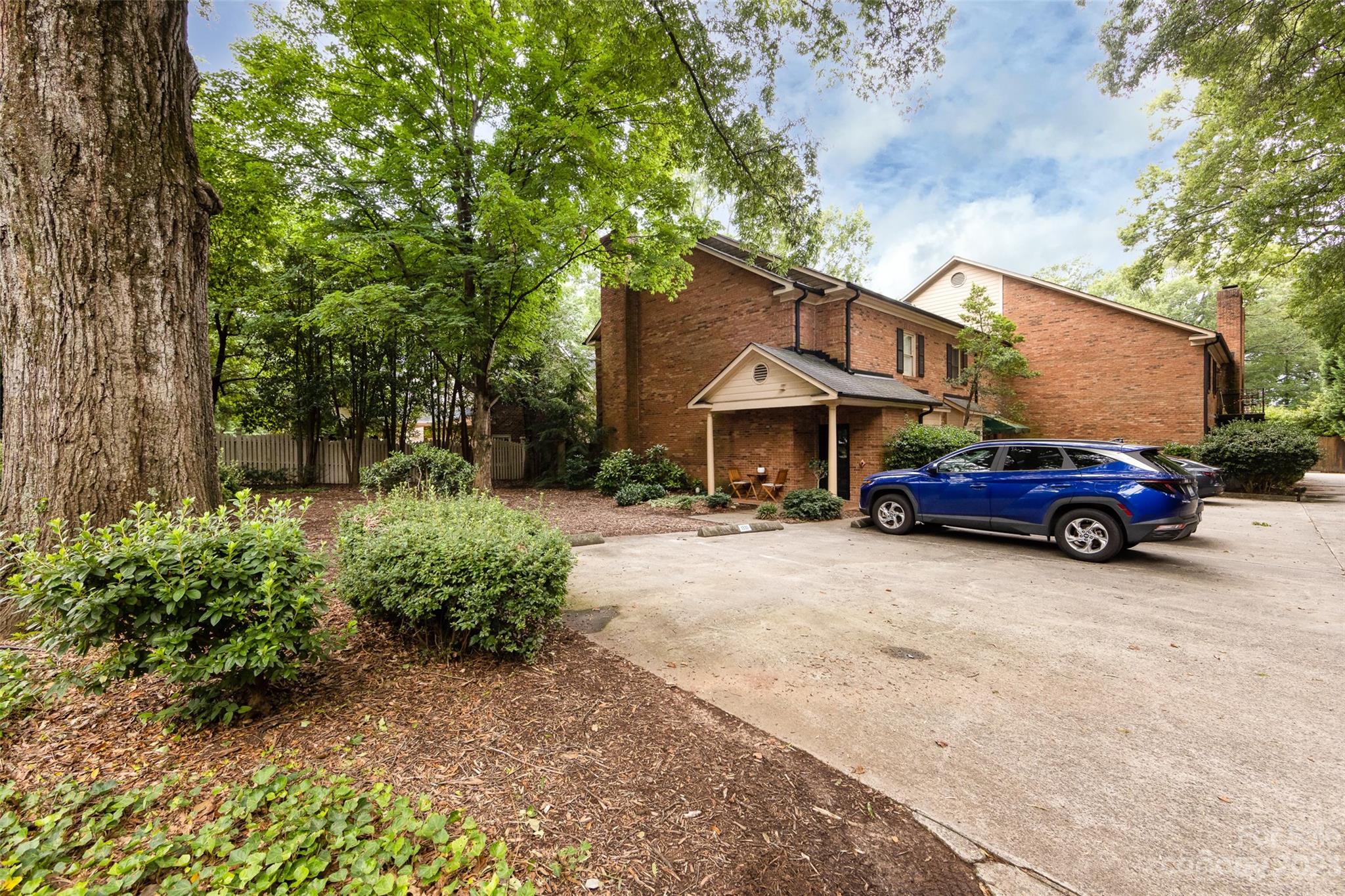 1336 Queens Road Charlotte, NC 28207 - Photo 2 of 36 a view of a car parked in front of a house