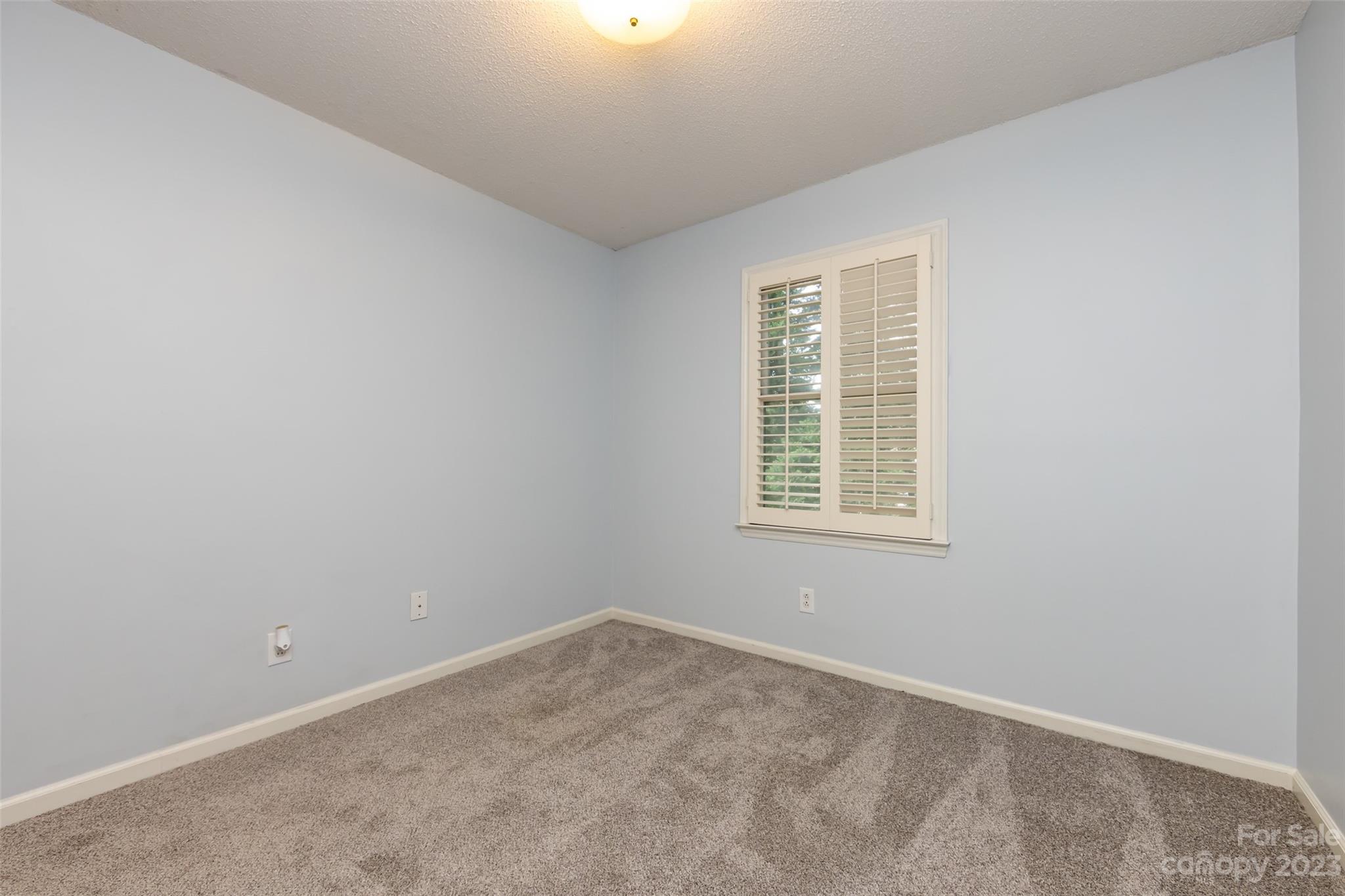 1336 Queens Road Charlotte, NC 28207 - Photo 34 of 36 an empty room with a window