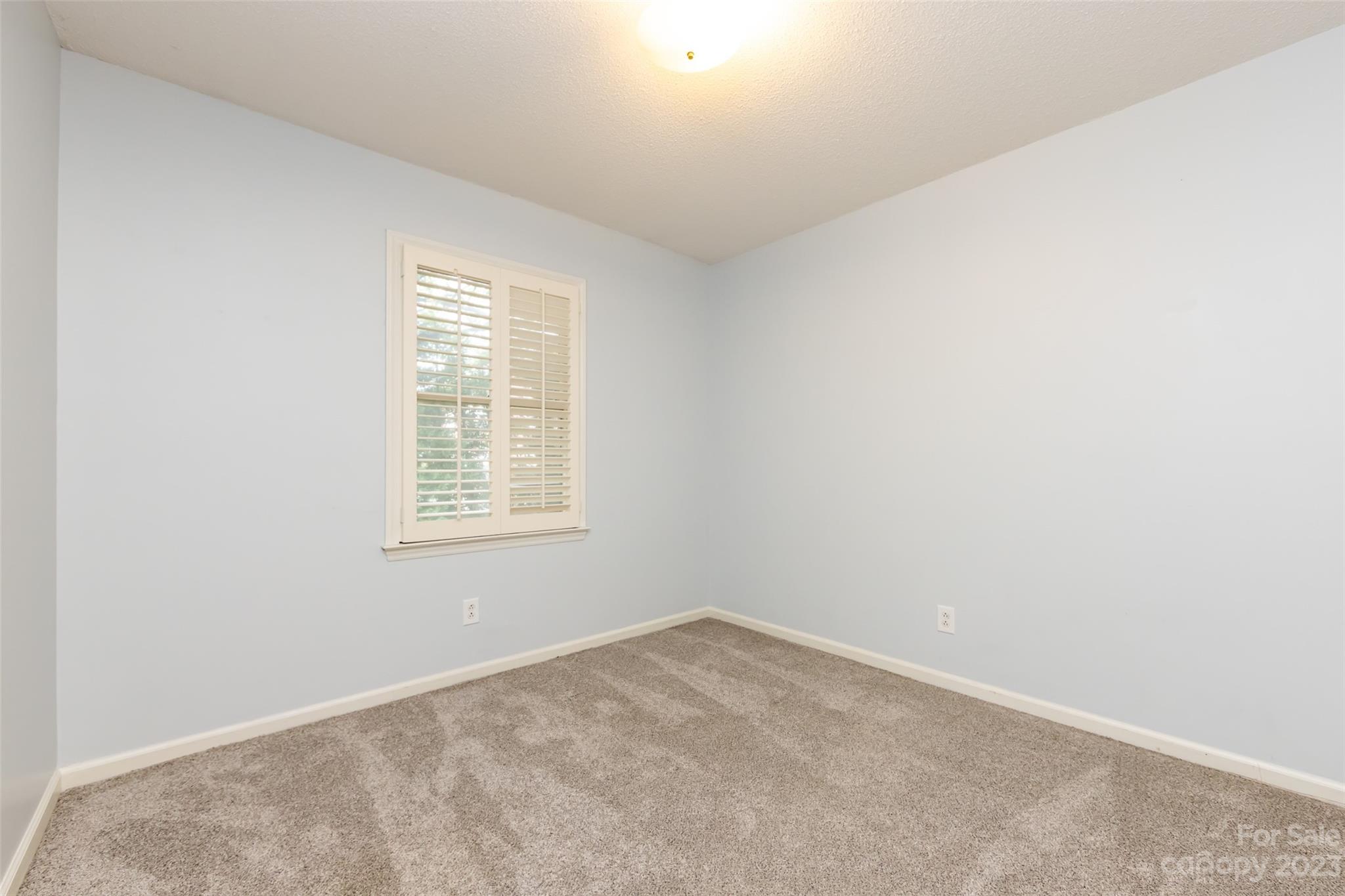 1336 Queens Road Charlotte, NC 28207 - Photo 35 of 36 an empty room with a window