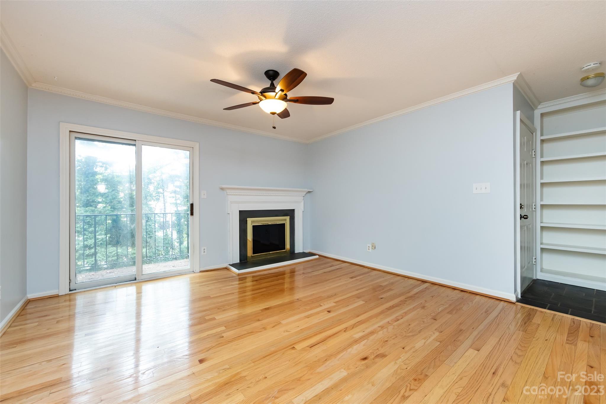 1336 Queens Road Charlotte, NC 28207 - Photo 10 of 36 a view of empty room with wooden floor and fan